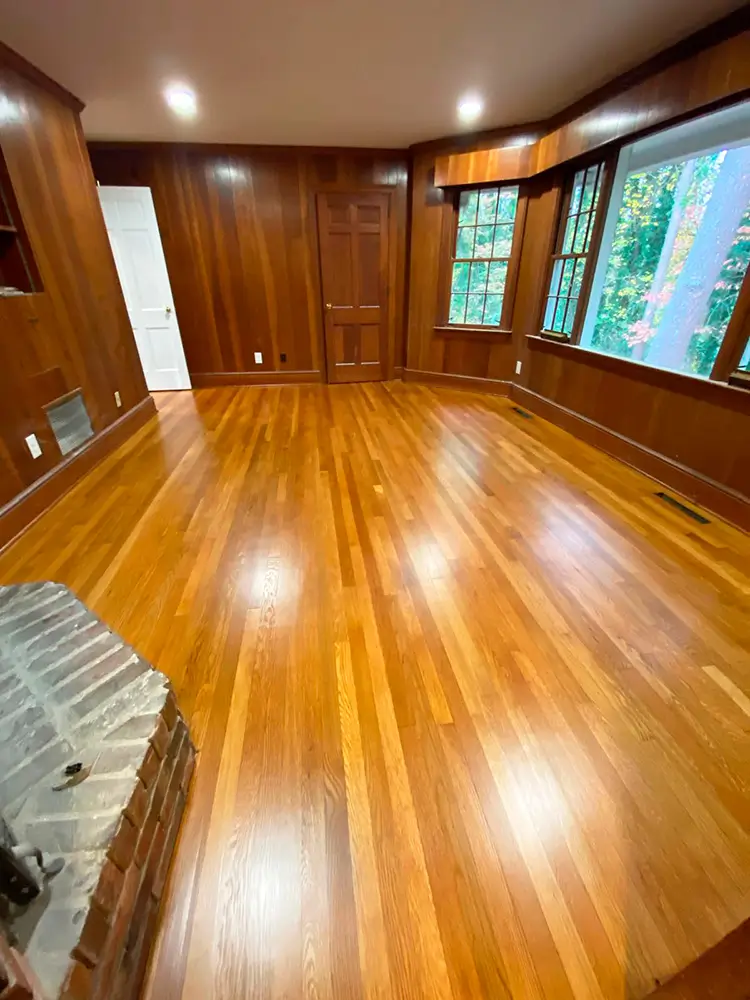 Glossy hardwood floor refinishing in Cary NC home