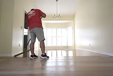 Hardwood Rescue NC team working on floor refinishing