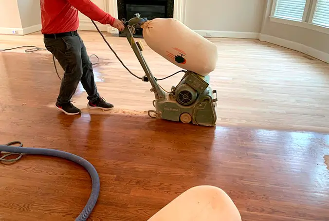 Hardwood floor refinishing with sanding machine Raleigh NC