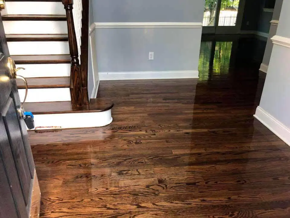 Hallway hardwood refinishing transformation Raleigh NC