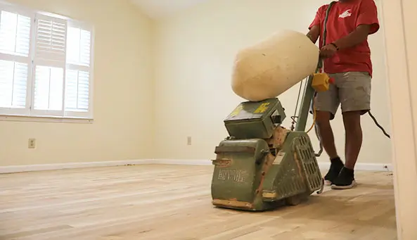 Expert sanding team working on hardwood floors